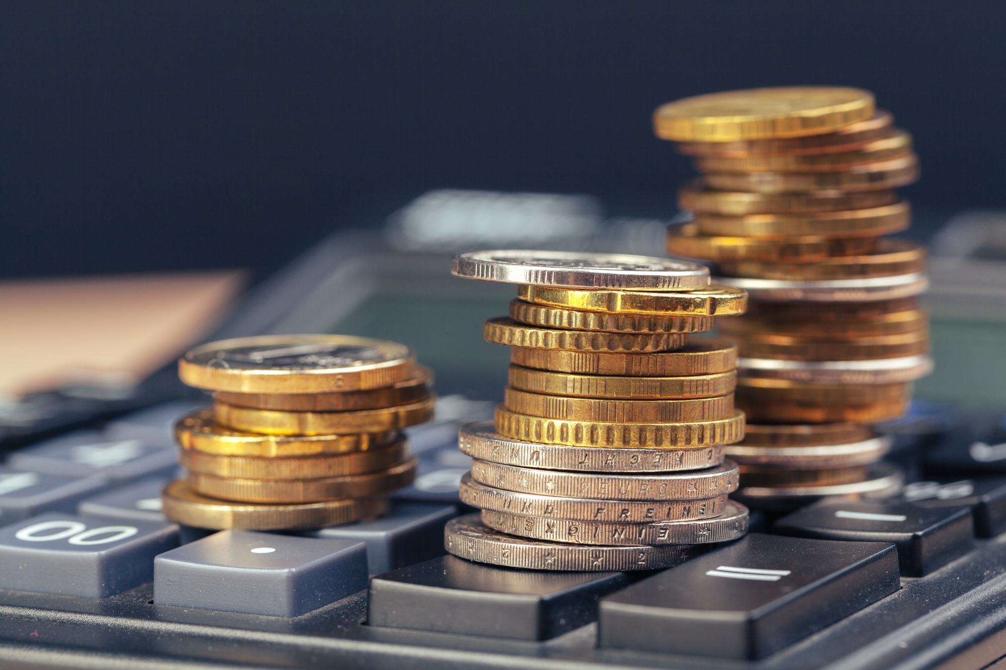 stack of coins and calculator,concept idea for business finance